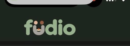 Füdio: sage lettering with two people sharing a meal in the contrasting u.